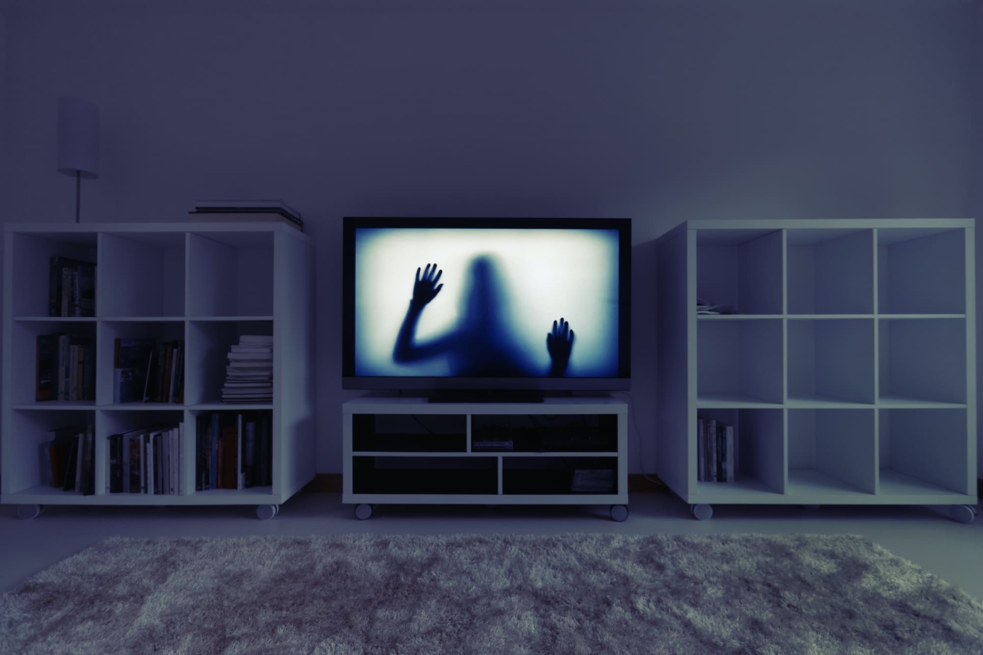 Silhouette of girl on television in white room escape room sydney