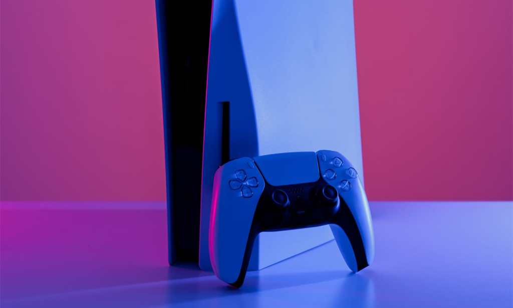 PS5 console and wireless controller against a purple background.