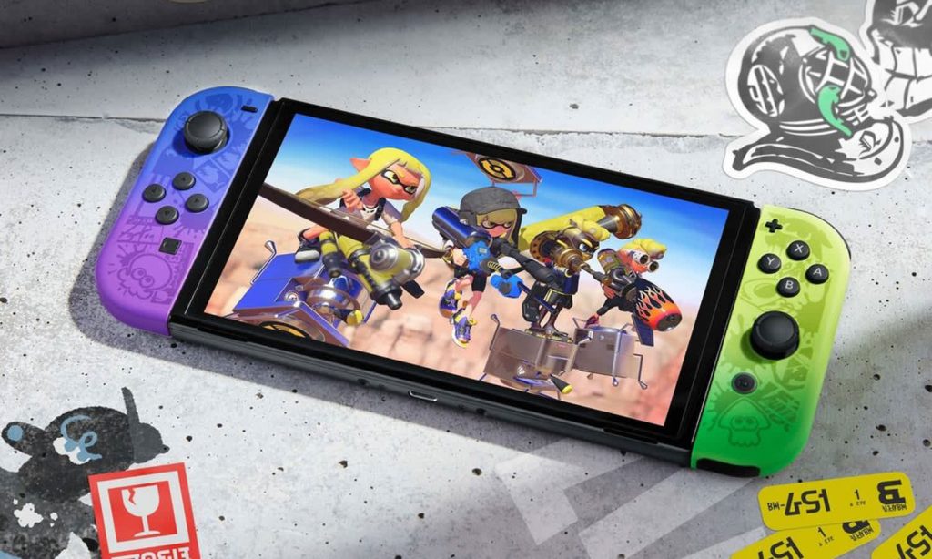 Top-down view of the Splatoon 3 Switch OLED console in handheld mode, with Splatoon 3 artwork on the screen.