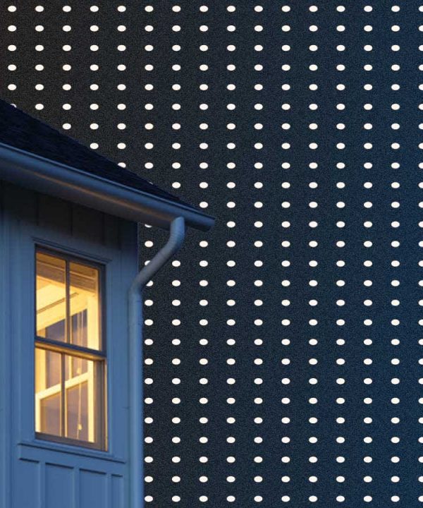 darkened house on a dark blue background with white polka dots