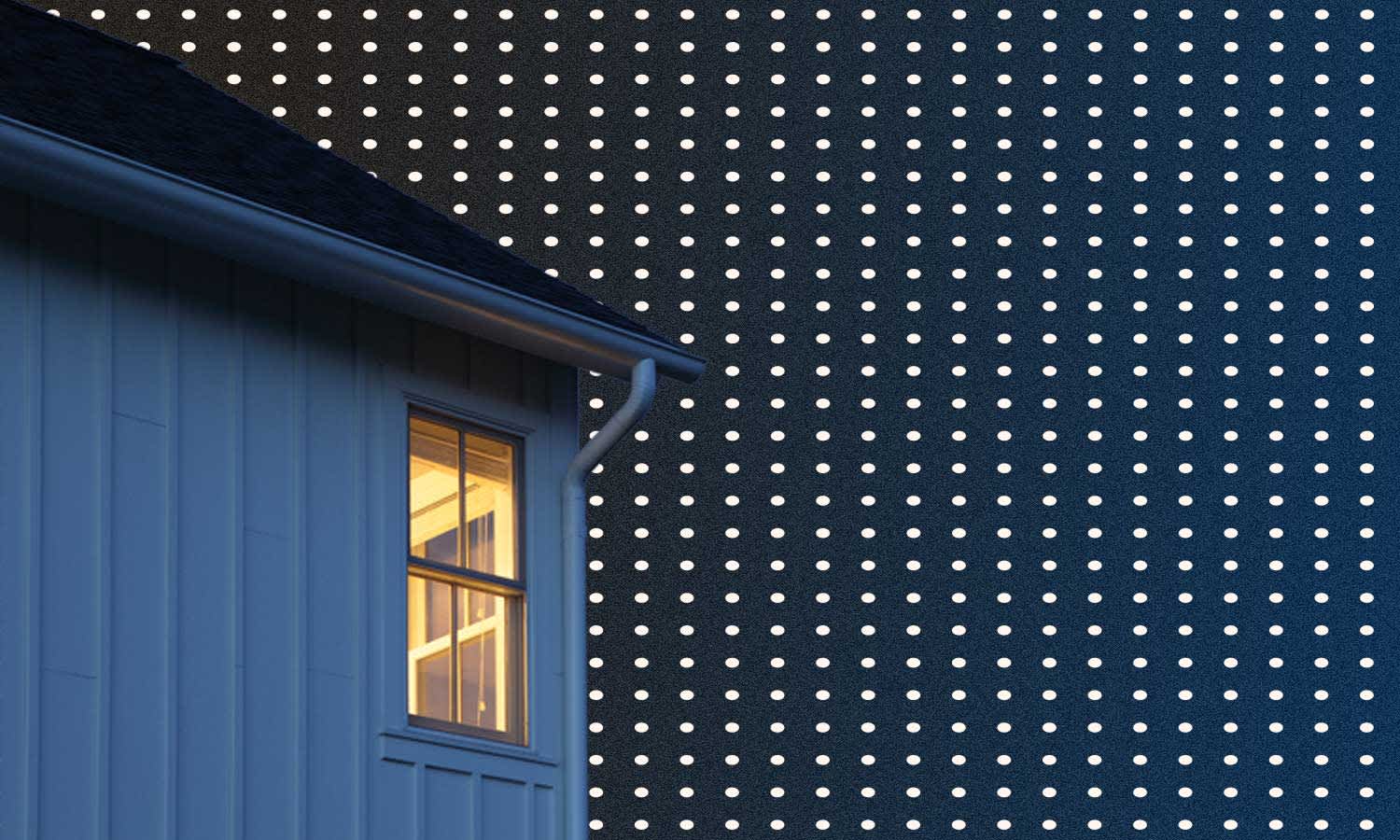 darkened house on a dark blue background with white polka dots