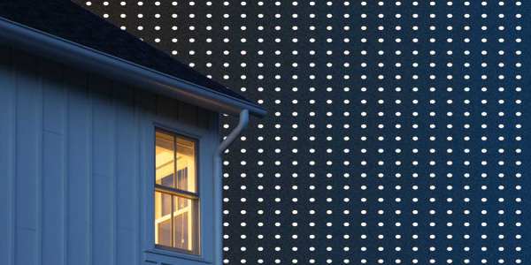 darkened house on a dark blue background with white polka dots