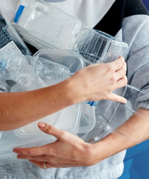 woman holding plastic containers