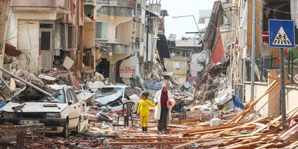 There has been another earthquake in Turkey. This image shows a woman and a young girl walking through the rubble in Hatay.