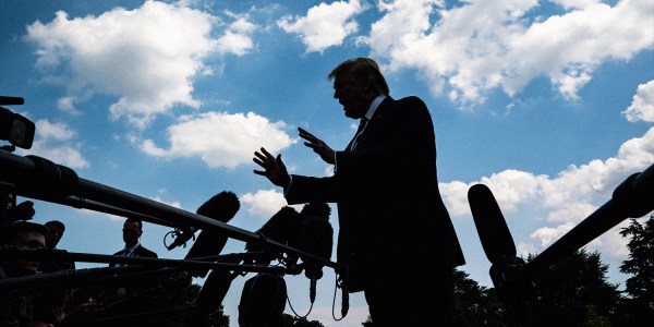 Donald Trump claims he might be arrested on Tuesday. Image shows Trump sihlouetted against a blue sky with white clouds.