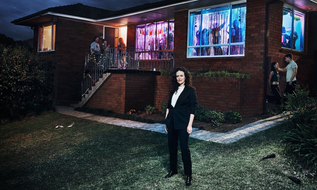 Photo showing journalist Jess Hill in front of a house party of young people to illustrate her new series 'Asking for It' on SBS.