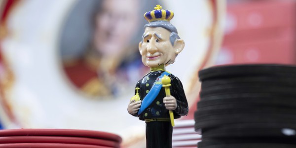 An image of a bobble-head King Charles to illustrate the preparation that London is going through for the coronation.