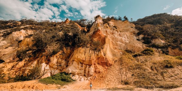 A view of the cliffs of Rainbow Beach to detail the accommodation options.