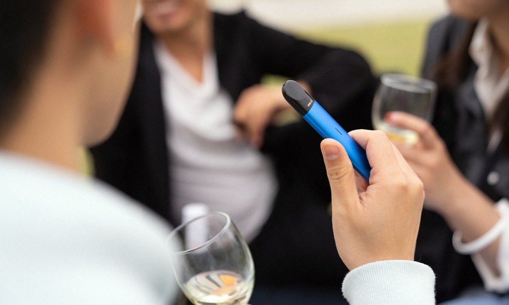 An image showing a man vaping to illustrate the cost of pharmacy vapes in Australia