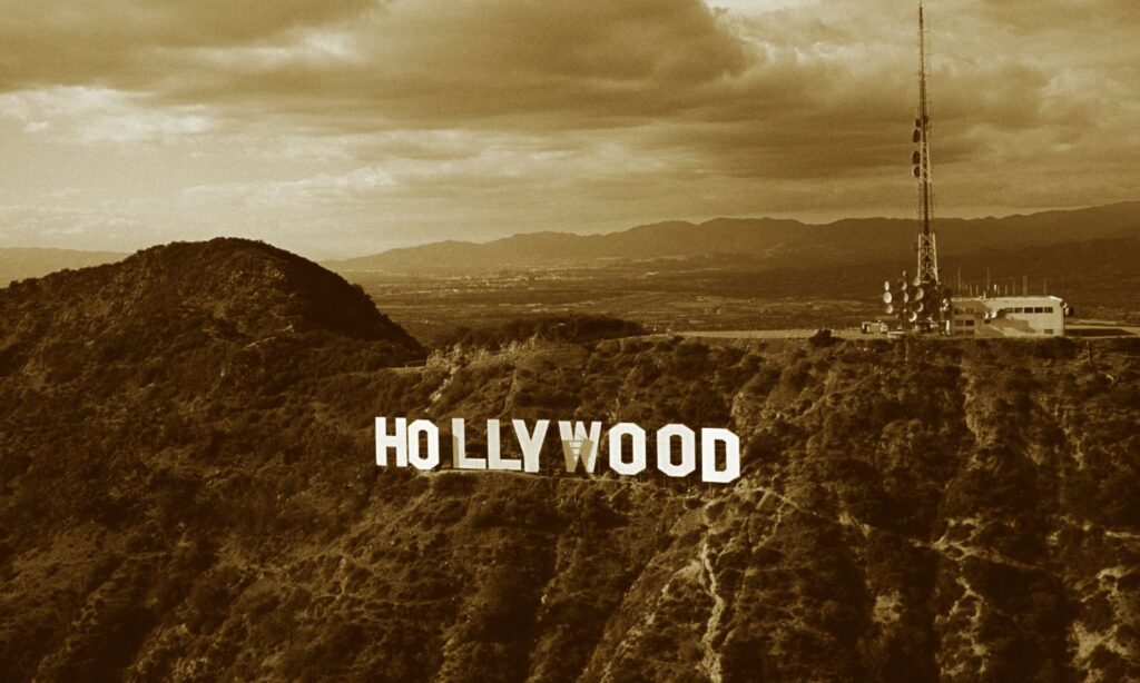 Photo of Hollywood Sign c 1991. The WGA is on strike for the first time since 2007. But what is the writers strike? And how does AI play a role?