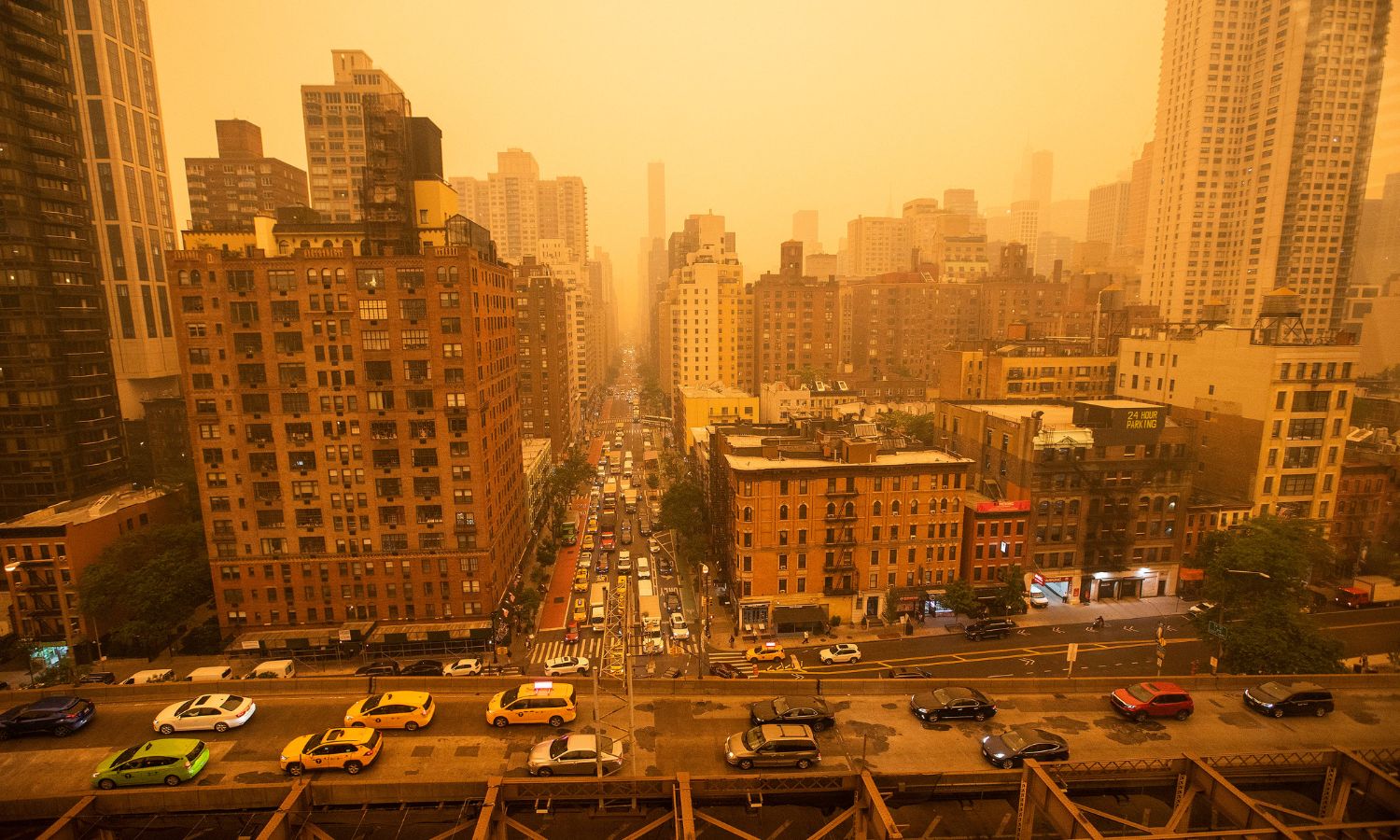 An Image showing downtown new york in which the city is engulfed in smoke.