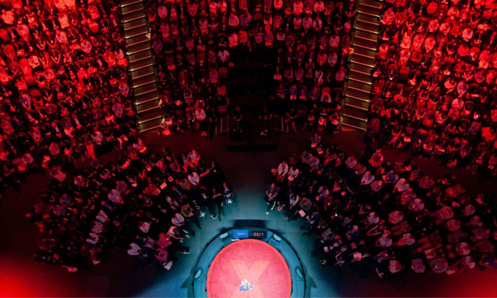 An image showing someone speaking at TEDxSydney