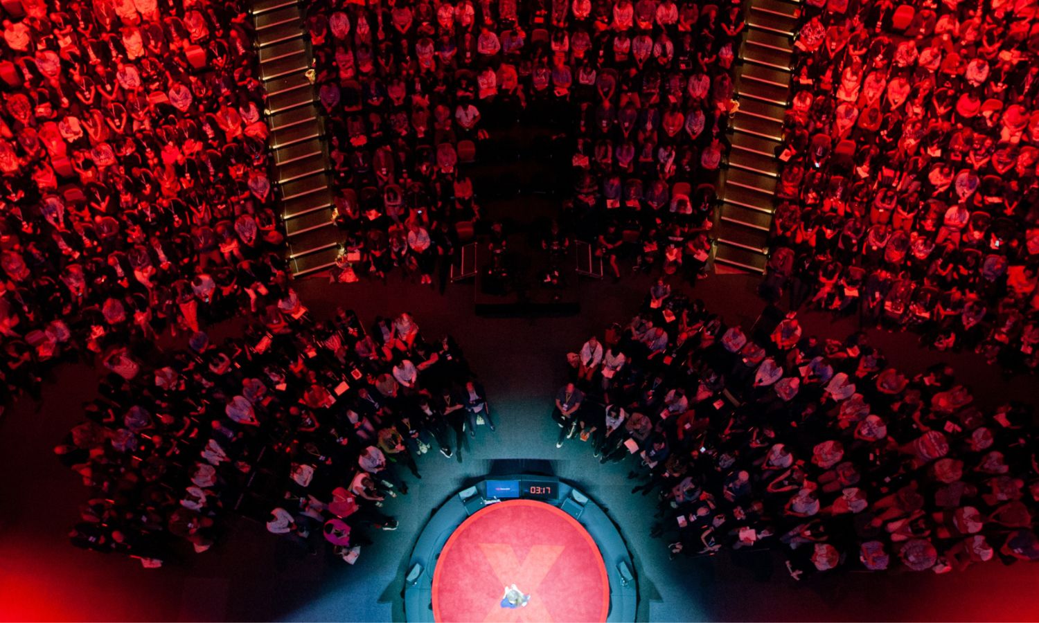 An image showing someone speaking at TEDxSydney