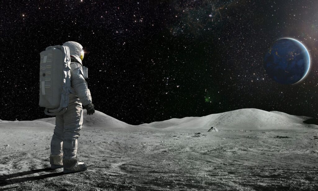 An image showing a spaceman looking out into space to illustrate a story on NASA looking for aliens and UAPs