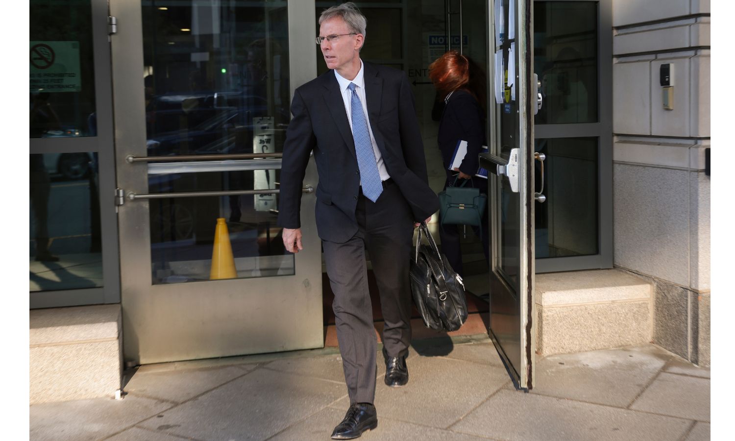 Google lawyer John Schmidtlein leaving DOJ federal court during the Google trial