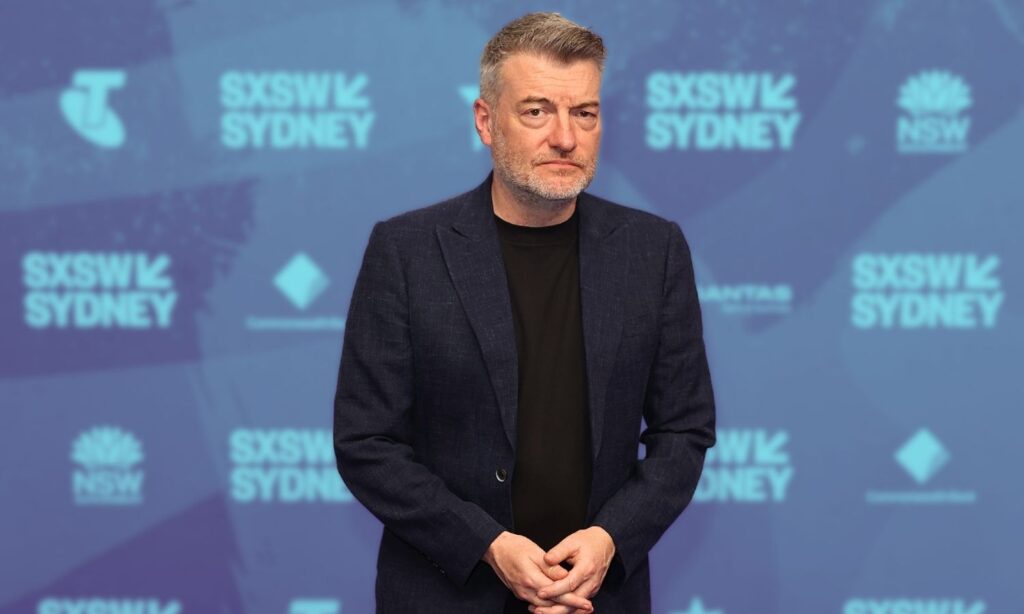 An image of charlie brooker at sxsw sydney speaking about AI