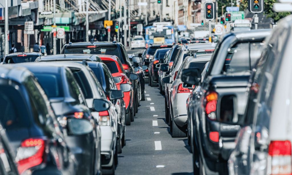 An image of traffic stopped when it could be being used to charge an EV