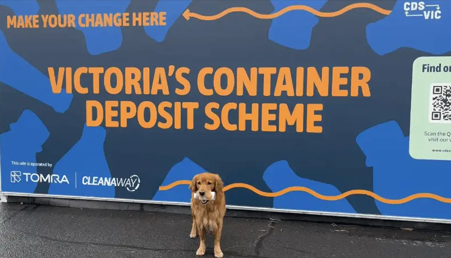 A dog next to a recycling scheme plant in Victoria.