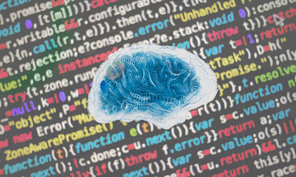 An image of a brain in front of computer code to illustrate thought to text technology