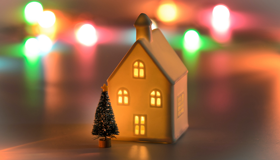 A miniature house with a Christmas tree