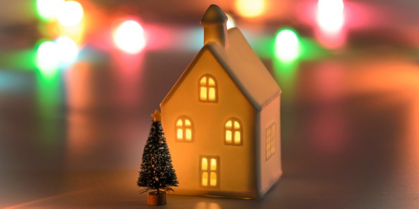 A miniature house with a Christmas tree